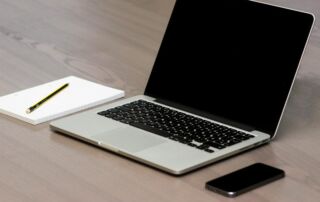 Free Silver Macbook Beside Iphone Stock Photo